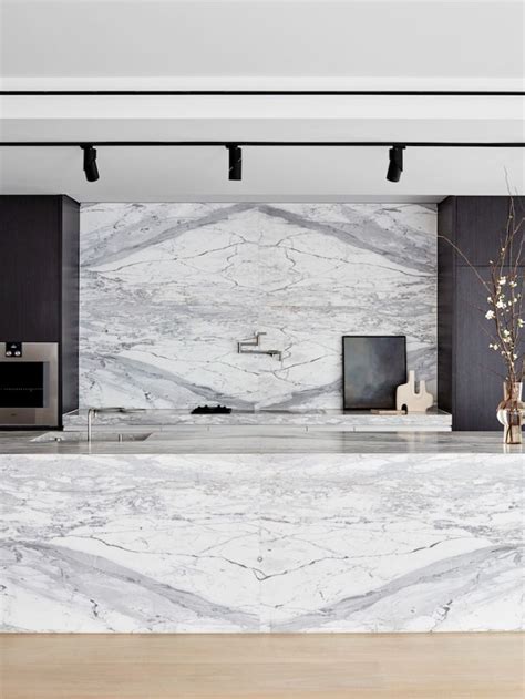 White marble called statuario, applied onto kitchen countertop, wall ...