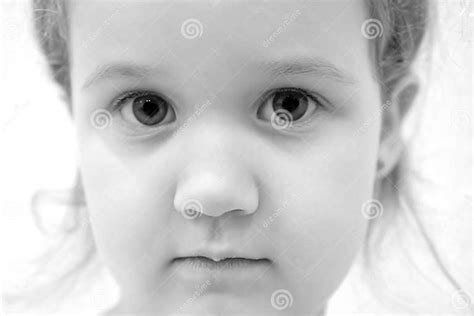 Closeup Portrait Of A Little Girl With Big Eyes Sad Eyes Stock Photo