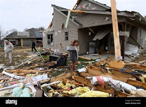 Jennifer Ricer Looks For Her Belongings In The Rubble Of Her Home On