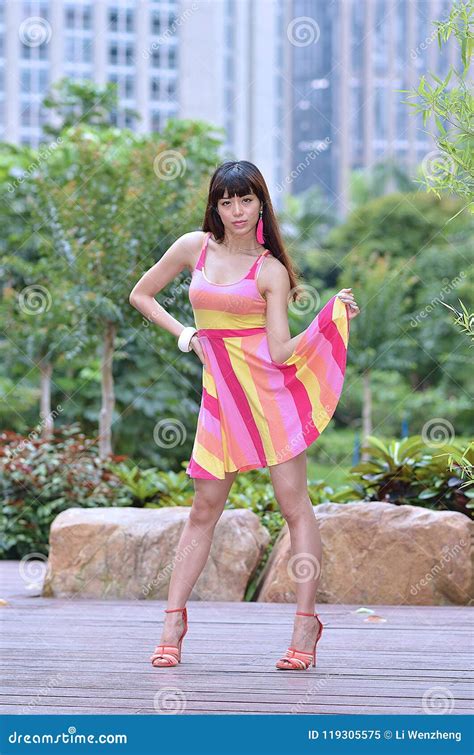 Beautiful And Sex Asian Girl Shows Her Youth In The Park Stock Image