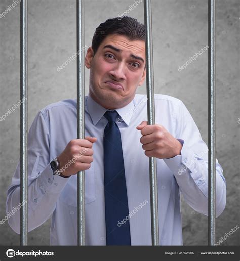 Young businessman behind the bars in prison — Stock Photo © Elnur