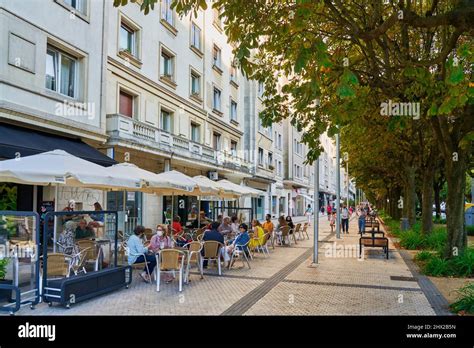 Citizens Having A Drink On A Terrace On Avenida Sancho El Sabio Barrio