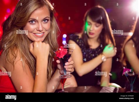 Pretty Blonde Drinking A Cocktail Stock Photo Alamy