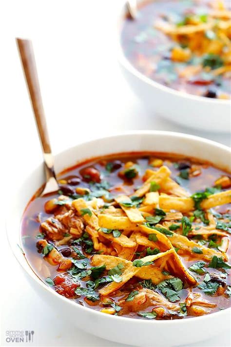 Two White Bowls Filled With Chili And Tortilla Soup