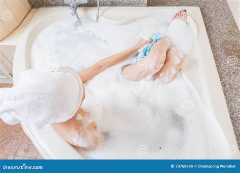 Beautiful Girl Showering And Washing Hands In Bathtub Royalty Free