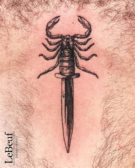 Scorpion dagger tattoo done on the sternum, engraving