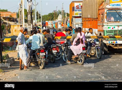 People Wait At The Railway Crossing Near Fatehpur Sikri India Stock