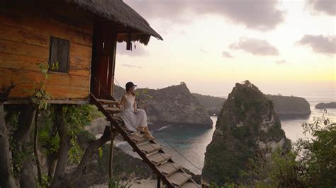 Nusa Penida Bali Indonesia K Of Woman White Dress Sit Of Tree House