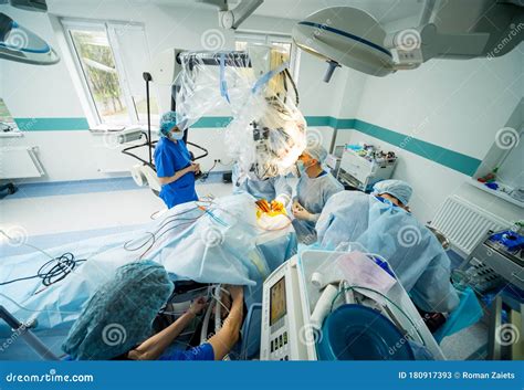 Brain Surgery Group Of Surgeons In Operating Room With Surgery