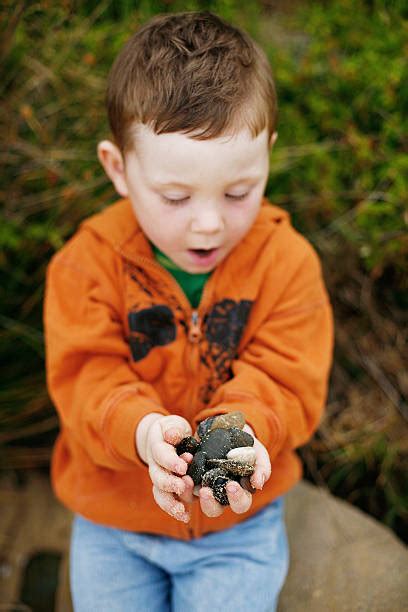 Kids Collecting Rocks Stock Photos Pictures And Royalty Free Images Istock