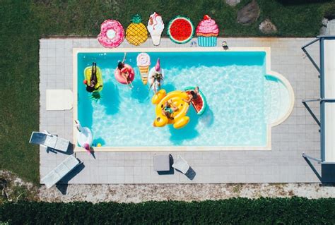 Premium Photo Group Of Friends Having Fun In The Swimming Pool