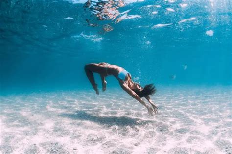 Naked Woman Free Diver Glides Over Sandy Sea With Fins Freedivi