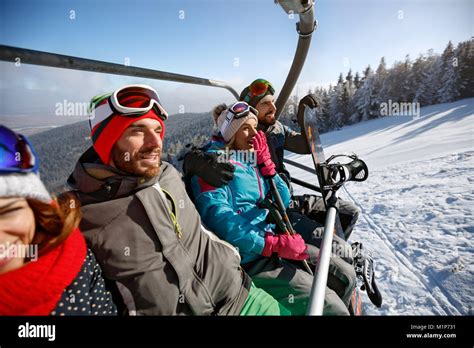 Skiers Going To Ski Terrain With Ski Lift On A Winter Sunny Day Stock