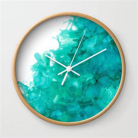 A Clock With Blue And Green Watercolor Paint On It S Face Showing The Time