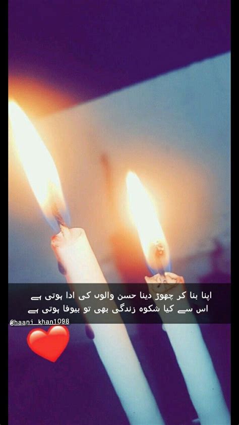 Three Lit Candles In The Shape Of Hearts With An Arabic Quote About