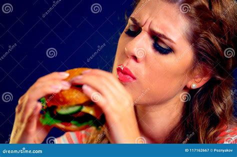 Woman Eating Fast Food Girl Enjoying Delicious Hamburger Stock Image