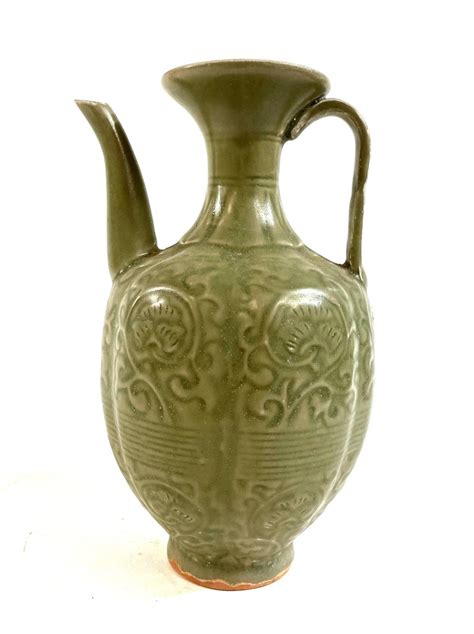 Lot A Longquan Celadon Glazed Ewer With Incised Chrysanthemum Detail