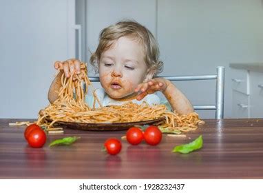 Funny Baby Child Getting Messy Eating Stock Photo (Edit Now) 1928232437