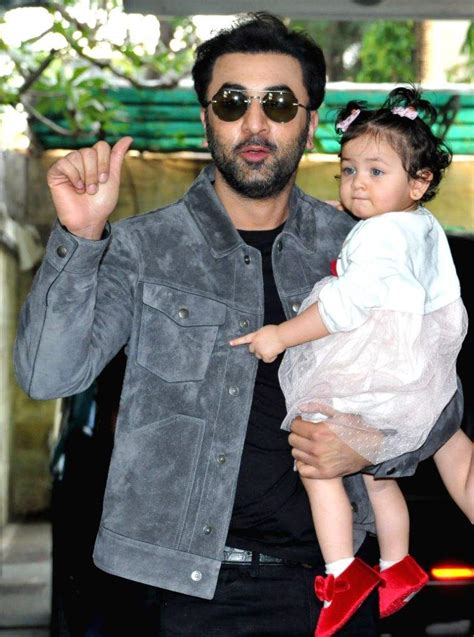 Actors Ranbir Kapoor and Alia Bhatt with their daughter Raha