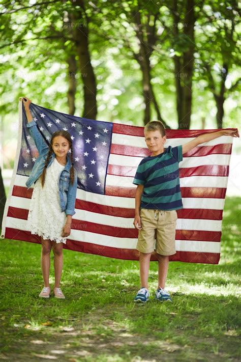 American Kids Holding National Flag - Stock Photos | Motion Array