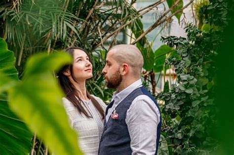 Premium Photo Beautiful Couple Girl And Guy In The Park Among Tropical Trees