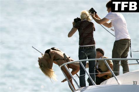 Pamela Anderson Poses Topless And In A Bikini On A Boat In Cannes