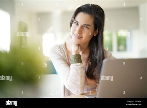 Portrait Of Brunette Girl Working On Laptop Computer Stock Photo Alamy