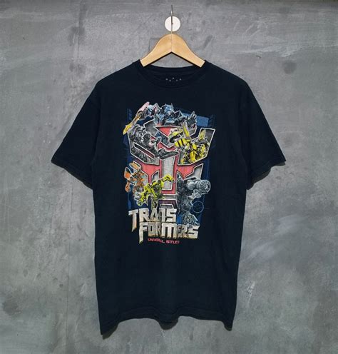 UNIVERSAL STUDIOS TRANSFORMERS, Men's Fashion, Tops & Sets, Tshirts & Polo Shirts on Carousell