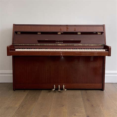 A Yamaha Upright Piano, Mahogany Gloss