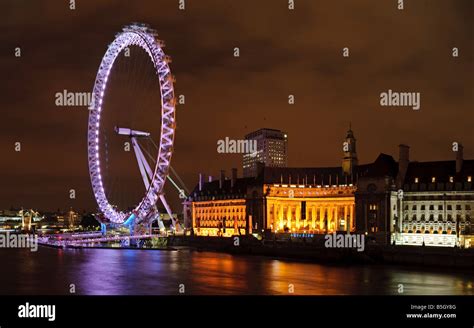 London Eye Millenium Wheel At Night With The River Thames Stock Photo