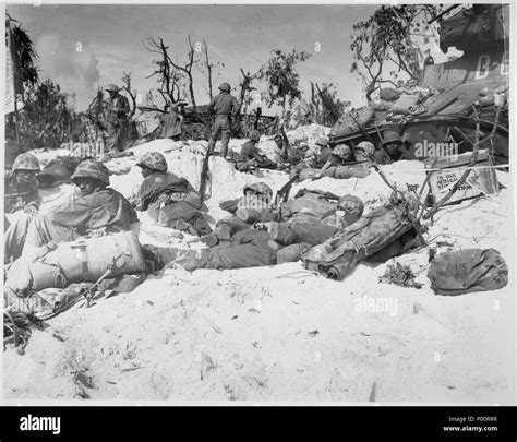 Peleliu Island Marines Move Through The Trenches On The Beach During