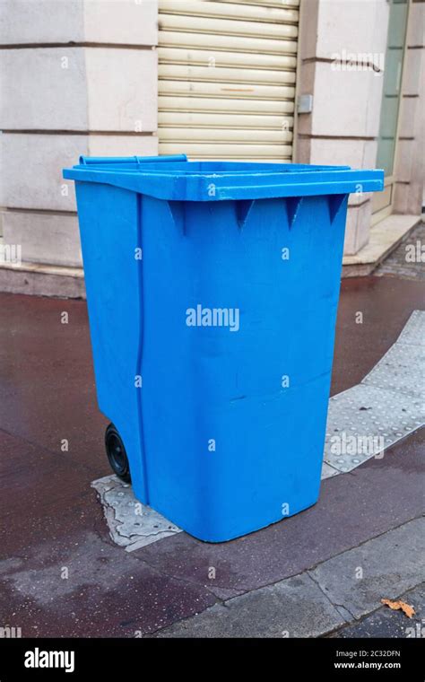 Big Blue Wheelie Bin At Street Curb Stock Photo Alamy