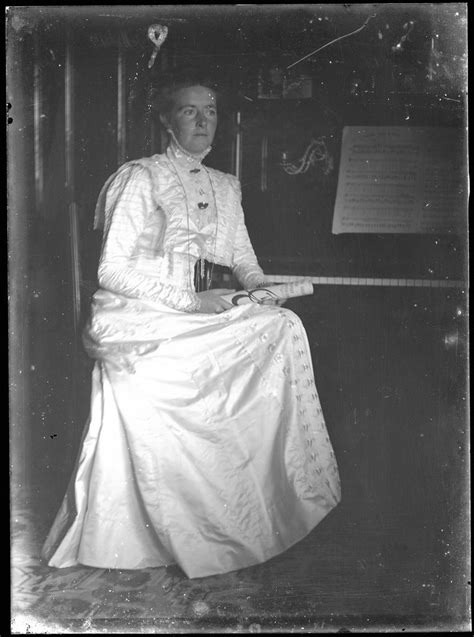 Young Woman Seated By Piano Palmerston North Libraries And Community