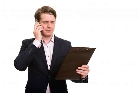 Premium Photo Handsome Caucasian Businessman Reading Clipboard While