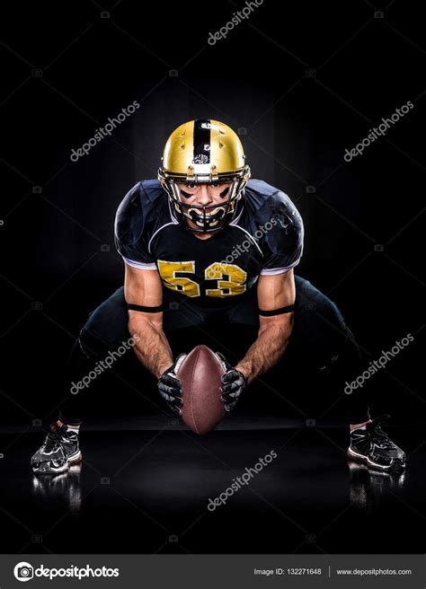 American football player holding ball — Stock Photo © DmitryPoch #132271648