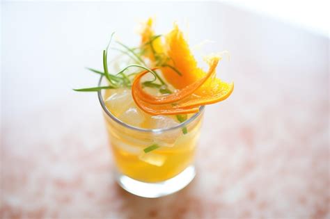 Premium Photo Closeup Of Orange Twist Garnish On Glass Rim