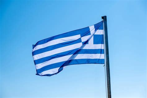 Premium Photo Greek Flag Waving Against Blue Sky Background