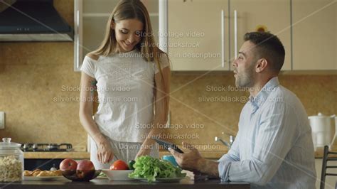 Attractive Couple Chatting In The Kitchen Early Morning Beautiful Woman Feed Her Husband While