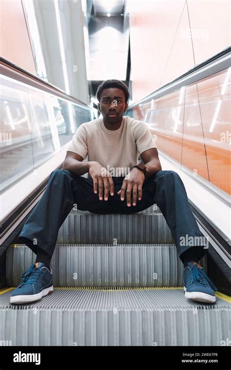 Man Sitting On Escalator Hi Res Stock Photography And Images Alamy