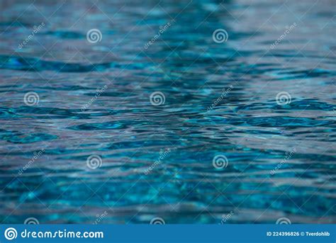 Abstract Ripple Wave And Clear Turquoise Water Surface In Swimming Pool