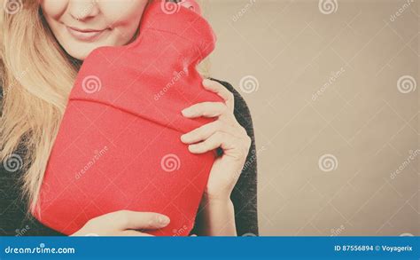 Woman Holding Warm Red Hot Water Bottle Stock Photo Image Of Calm Face 87556894