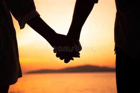 Couple Hold Hands In Summer Time On Sunset At Beach Stock Image - Image ...