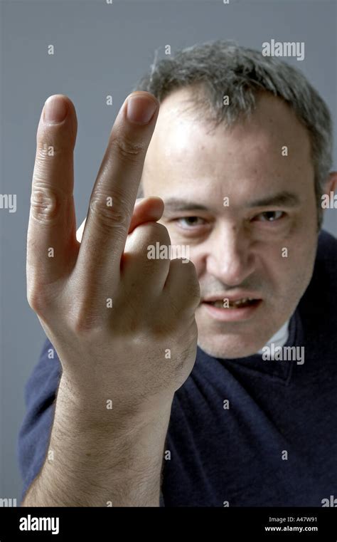 Angry Man Making Rude Fuck Off V Sign Gesture With Two Fingers Focus On