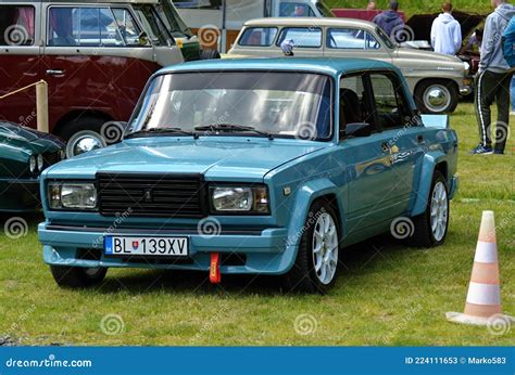 The Driver Of VAZ 2105 Waving On The Roof Of The Car During The Show ...