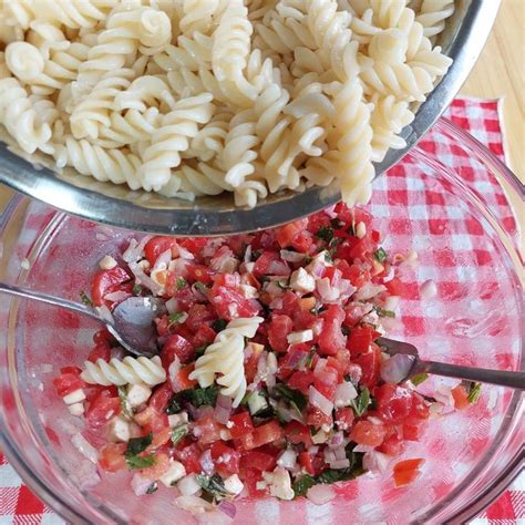 Pasta Salad Being Made In A Glass Bowl