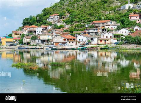 small village reflected   water   albanian border