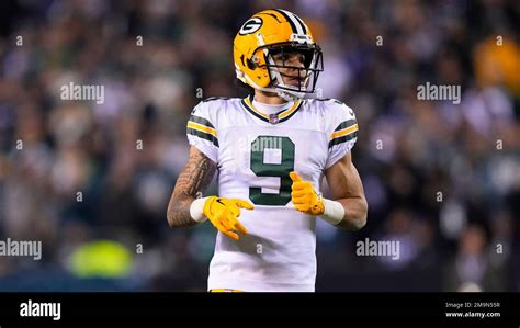 Green Bay Packers Wide Receiver Christian Watson In Action During An