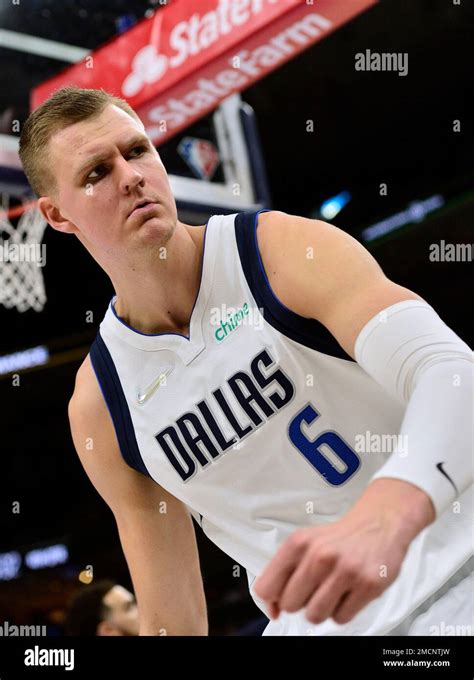 Dallas Mavericks center Kristaps Porzingis reacts after a dunk during the second half of the ...