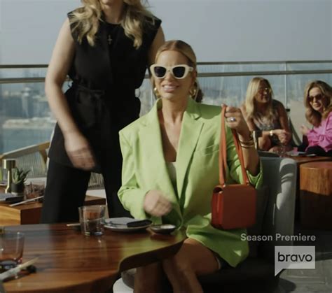 Caroline Stanbury S Green Blazer And White Sunglasses