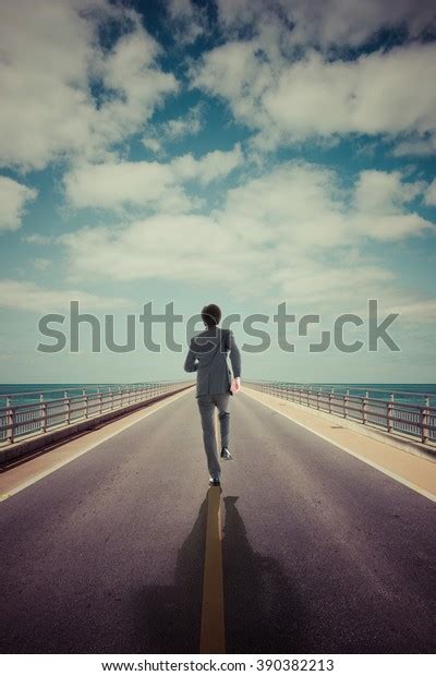 Businessman Walking Straight Road Stock Photo Edit Now 390382213